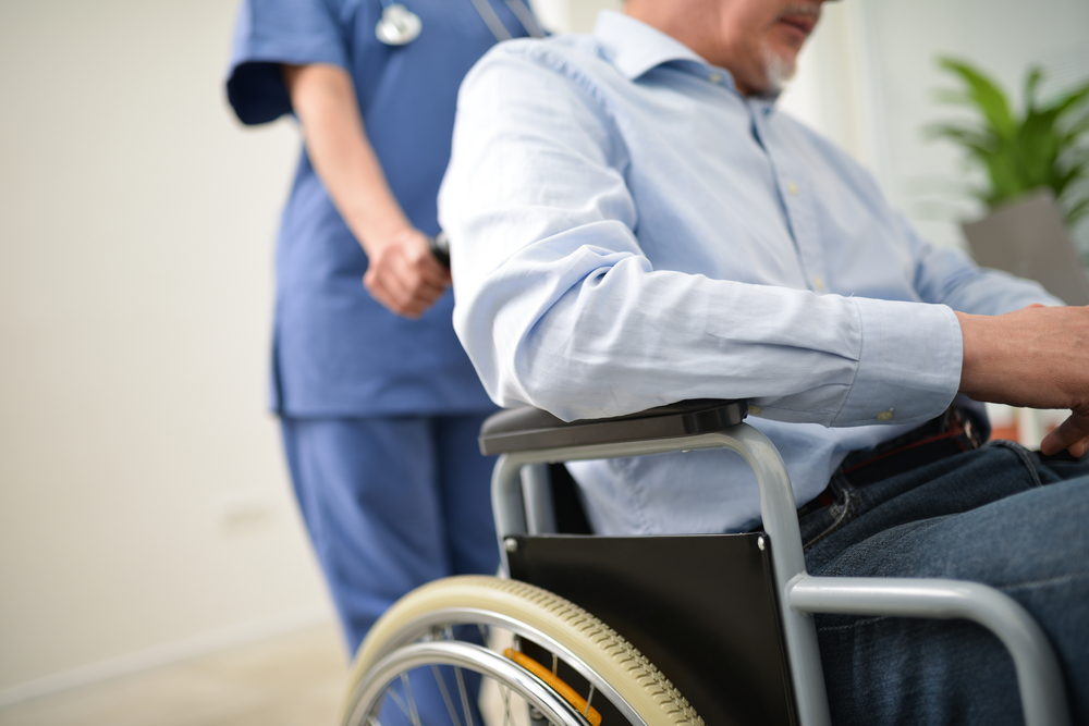 Nurse,Pushing,An,Injured,Patient,On,A,Wheelchair